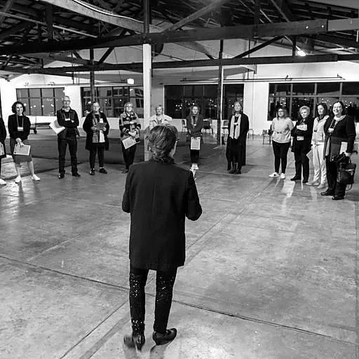 Ruth briefing a group in a warehouse studio
