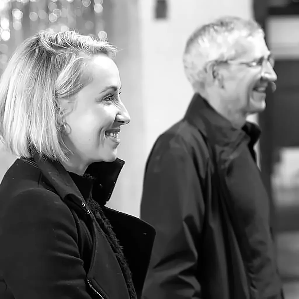 Two colleagues laughing together